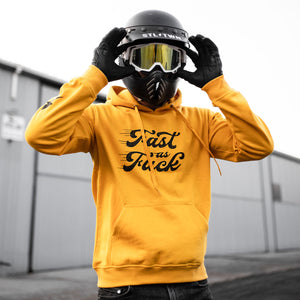 Rider wearing Fast As Fuck Hoodie next to motorcycle